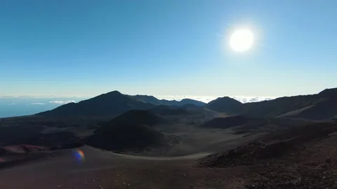 Aerial diving view along ashes of volcanoes valley during sunrise in Hawaii 4K Video stock 196907670