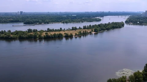 Aerial Dnieper River in Kiev.  Green trees, beautiful view. Drone Stock Footage 128732553