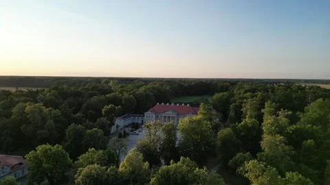 Aerial Dolly Forward Shot Approaching Historic Palace at Sunset Stock Footage 323768564