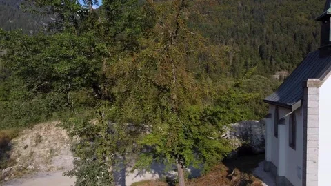 Aerial dolly right over a small church in the forest Video stock 152047273