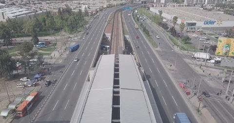 AERIAL DOLLY IN OF TRAIN METRO SUBWAY OF SANTIAGO WITH VIEWS OF THE CITY 4K Stock Footage 101334064