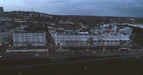 Aerial dolly view of the seafront in Brighton (England) after sunset Stock Footage 80418236