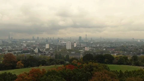 Aerial dolly view of the skyline of central London from a park on the North side Stock Footage 97142894