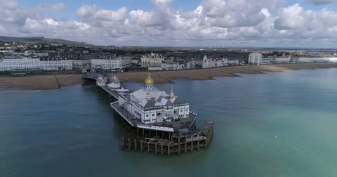 Aerial dolly view of the Victorian pier in Eastbourne, Southern England Stock Footage