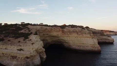 Aerial Down Pan from Clear Blue Sky to Cliffs and Ocean Stock Footage 249228362