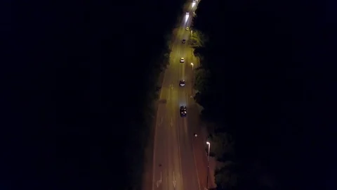 Aerial down view shot of a rural European car road at night Video stock 79010059