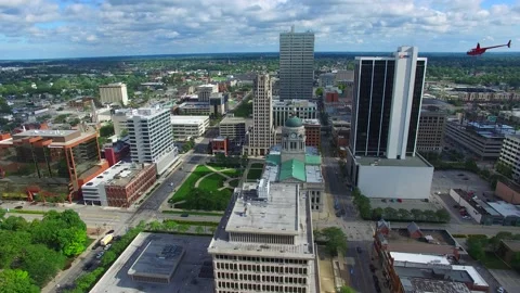 Aerial of downtown Fort Wayne, Indiana courthouse with helicopter Stock Footage