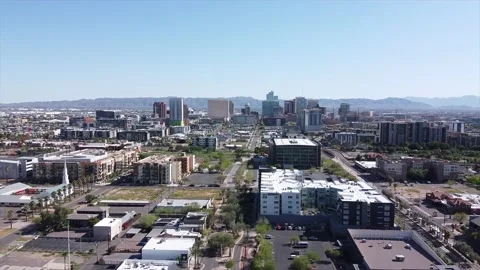 Aerial of Downtown Phoenix with south mountain in background Stock Footage
