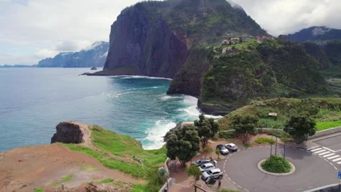 Aerial of dramatic cliffs of Madeira overpassing Miradouro do Guindaste Video stock 329119694