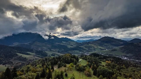 Aerial Dramatic clouds moving fast over autumn countryside in Europe Hyper lapse Stock Footage 292795751