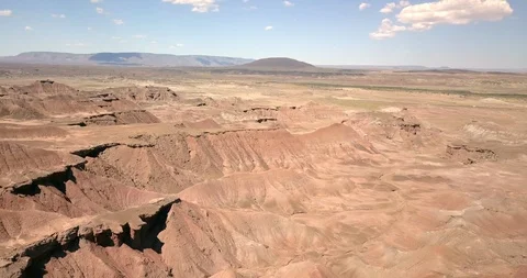 Aerial dramatic flight over the ridges and canyons of the Painted Desert Stock Footage 111302050