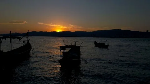 Aerial dramatic footage during sunset with fisherman boat Stock Footage 102812789