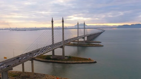 Aerial dramatic sunrise view with traffic at first Penang Bridge, Malaysia Stock Footage 116974778
