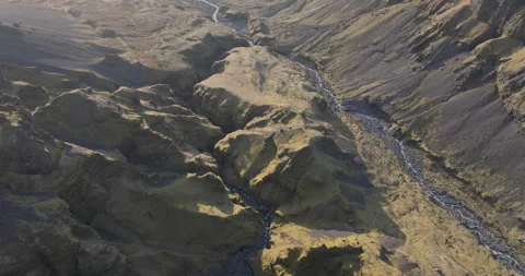 Aerial of Dramatic Volanic Canyon and Riverbed Stock Footage 321661868
