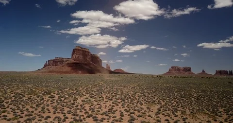 Aerial - dramatic weather - chasing a dust devil through Monument Valley Stock Footage 107115153