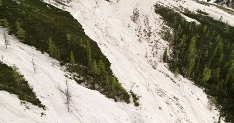 Aerial of dried up alpine river bed. Stones and rocks in Fanes above lake Stock Footage 148533127