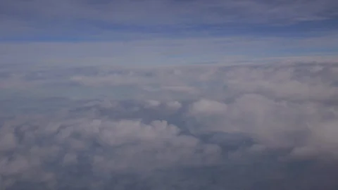 Aerial drifting across cloudscape in the sky with gentle blue background 스톡 동영상 101302810