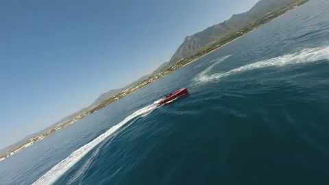 Aerial dron view fast red motor boat move blue water surface. Speedboat sailing. Stock Footage 276520401