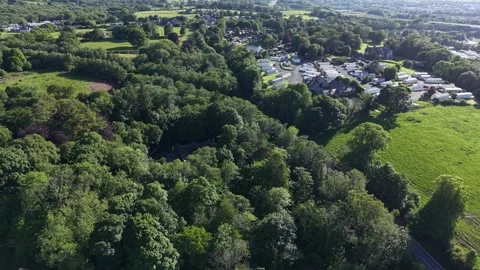 Aerial drone 4K view of caravan park near open farmland meadow Wales 스톡 동영상 337297468