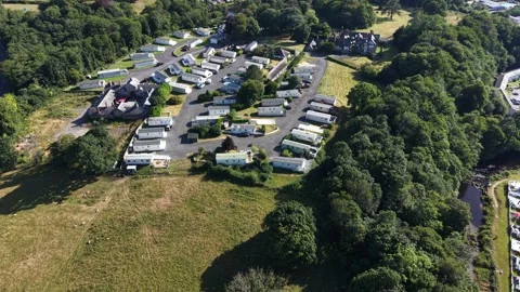 Aerial drone 4K view of caravan site near countryside meadow Wales 库存影片 339808992