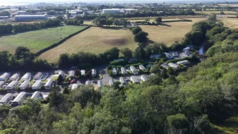 Aerial drone 4K view of caravan park across open valley greenery Wales 库存影片 339809103