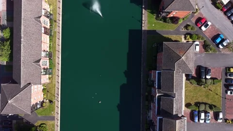 Aerial drone 4K view of Merseyside neighbourhood in strong sun Merseyside Stock Footage 337833209