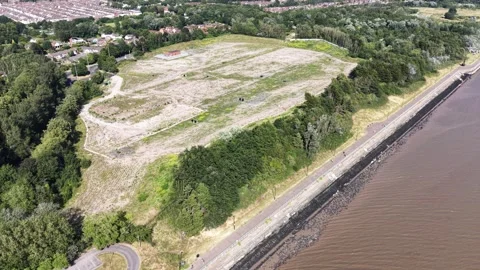 Aerial drone 4K view of Merseyside housing estate in strong daylight Merseyside Stock Footage 337833722