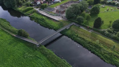 Aerial drone 4K view of town neighbourhood with natural green surroundings Видео 337300299