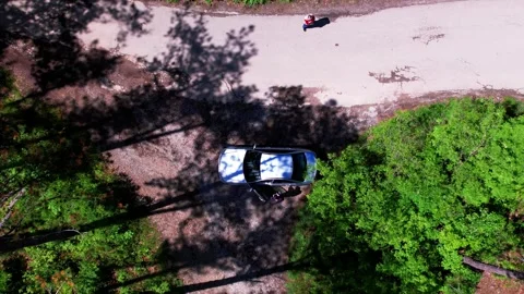 Aerial drone 4K view of vertical takeoff in mountain narrow street surrounded Stock Footage 241177581