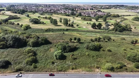 Aerial drone 4K view of Wallasey residential streets in warm daylight Wallasey Stock Footage 343157458