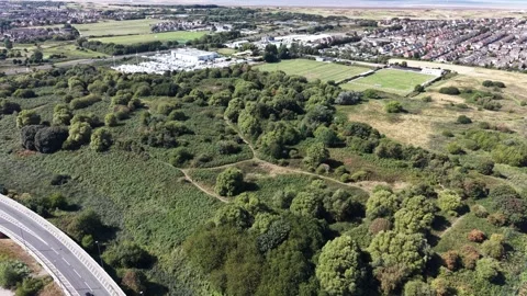 Aerial drone 4K view of Wallasey housing rows glowing in warm daylight tones Stock Footage 343160160
