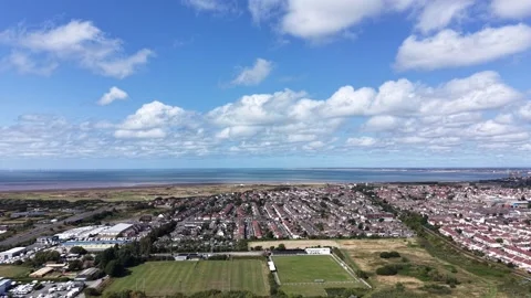 Aerial drone 4K view of Wallasey suburban streets glowing in warm sky light Stock Footage 343160422
