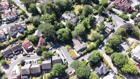 Aerial drone 4K view of Wirral neighbourhood glowing in warm daylight Wirral Video stock 342283293