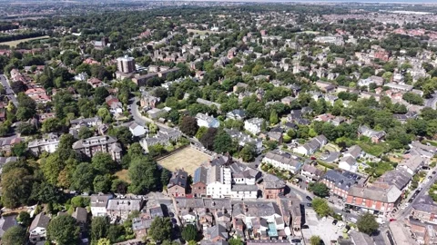 Aerial drone 4K view of Wirral housing estate glowing in warm afternoon sky Video stock 342283644