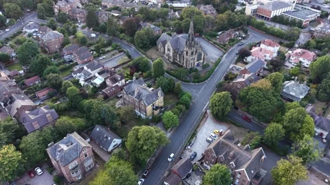 Aerial drone 4K view of Wirral housing blocks glowing in warm afternoon daylight Video stock 342285260