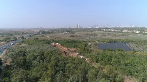 Aerial drone above construction site outside at nature with green trees around Stock Footage 131015960