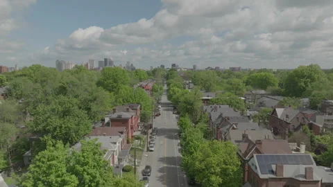 Aerial drone advancing above tree-lined street in Louisville Stock Footage 333176750