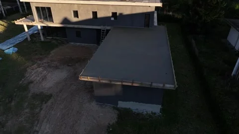Aerial drone approach to modern flat roof home under construction Stock Footage 324795978