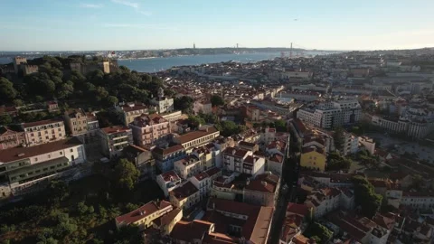 Aerial drone approaching Baixa District in Lisbon, Portugal with major landmarks Stock Footage 240663283