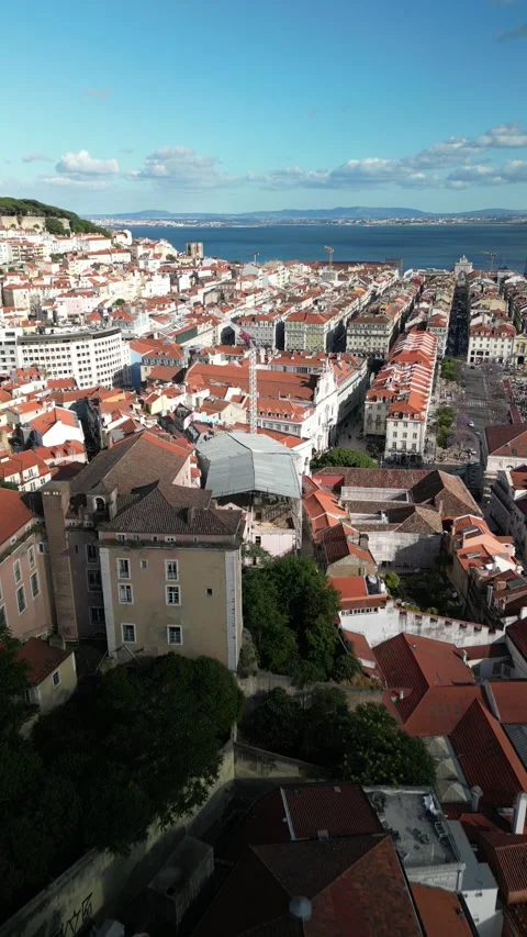 Aerial drone approaching Baixa District in Lisbon, Portugal with major landmarks Stock Footage 275621518