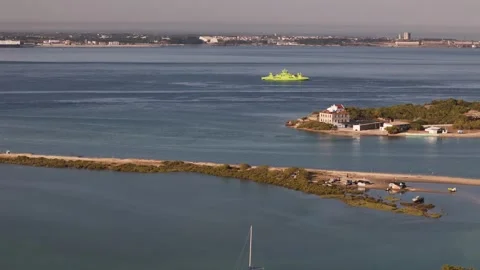 Aerial drone approaching ferry boat near Troia in Setubal region of Portugal Stock Footage 280180413