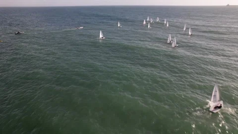 Aerial drone approaching a regatta of sloop sailboats in Cascais, Portugal Stock Footage 254336593
