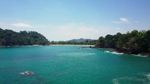 Aerial Drone Approaching Sandy Beach Rocky Coastline Manuel Antonio Costa Rica Stock Footage 336320872