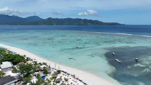 Aerial Drone Arc Shot Over Turquoise Sea From Gili Air Beach to Shore, Indonesia Stock-Footage 330978286