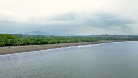 Aerial Drone of Beach and Ocean Under Bright Cloudy Sky Video stock 326328332