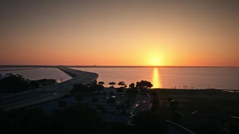 Aerial Drone Biloxi Beach and Bridges Mississippi Sunrise Sunset Cinematic Stock Footage 314015053