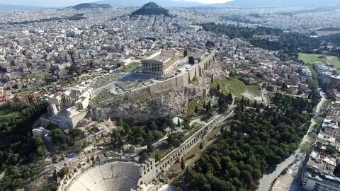 Aerial drone bird-eye view moving around front of Acropolis of Athens 4k Stock Footage 69779953