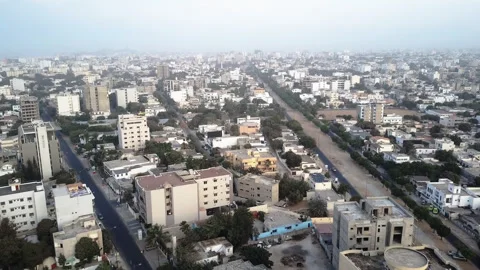 Aerial Drone Boom Down Tilt Up Revealing Dakar Senegal Cityscape Pollution Haze Stock Footage 335780682