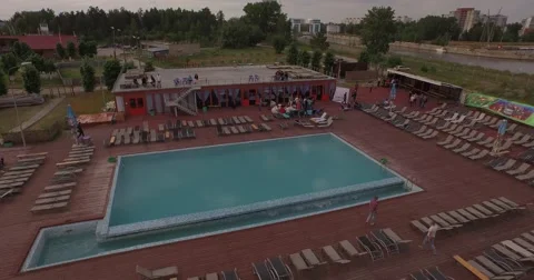 Aerial drone camera flies over swimming pool Stock Footage 56322705