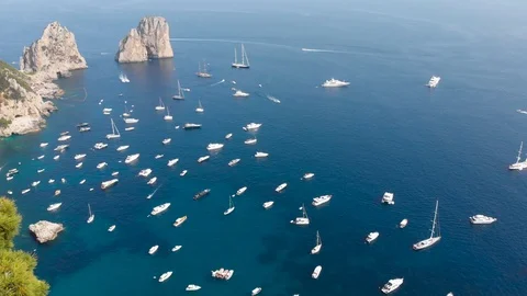 Aerial drone camera moves forward - huge number of luxury boats berth in sea Stock Footage 113715307